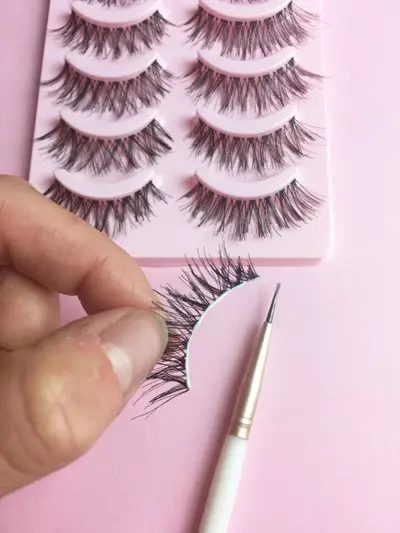 Putting glue on lashes