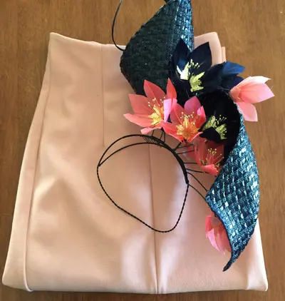 navy swirl millinery and pink skirt