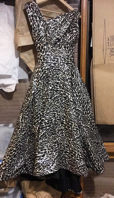 dress hanging on coat hanger black white leopard print