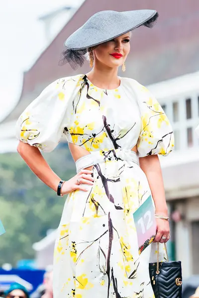 race day style yellow and black floral print dress dior hat
